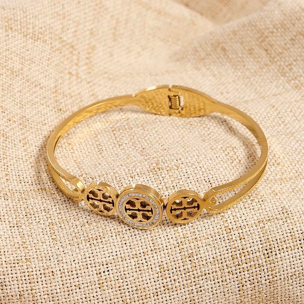 Tory Burch Elegant Gold and Silver Bracelet